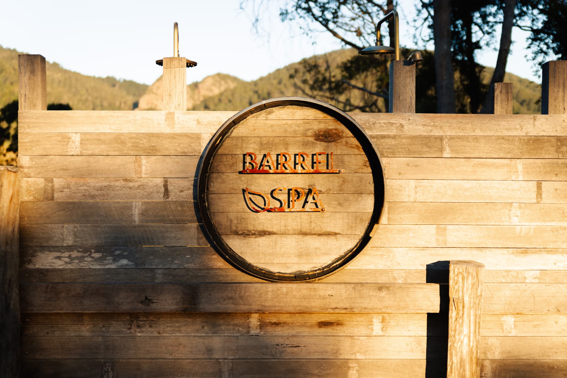 The Barrel Spa deck with outdoor showers and mountain views