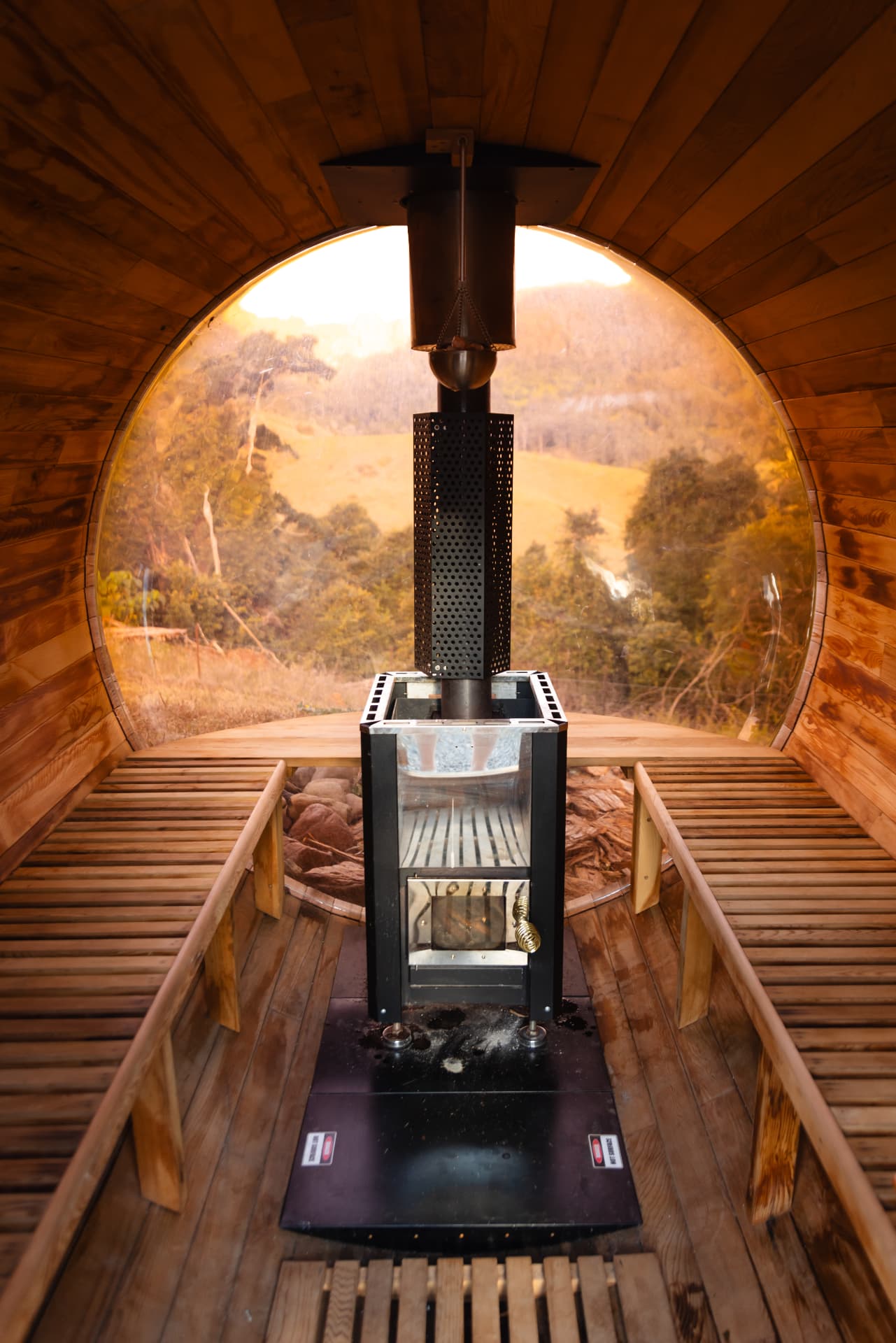 Inside the barrel sauna, looking out over the hillside